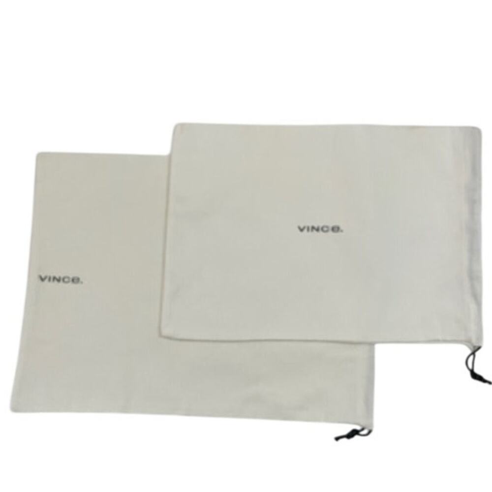 Vince. (2) cotton dust bags with drawstrings in white.